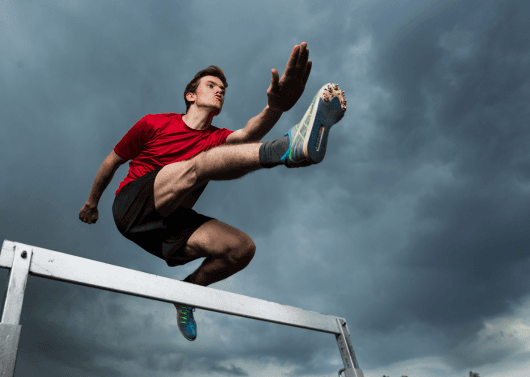 Women performing yoga at a large wellness marathon event in Hyderabad