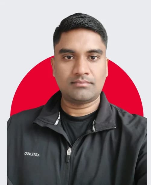 Energetic male yoga instructor leading meditation and pranayama class at FitMechanism center in Hyderabad