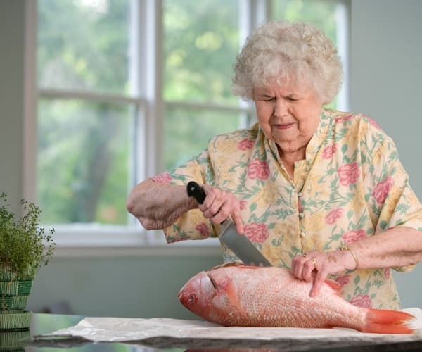 Happy multigenerational family supporting grandfather grandmother in senior citizen fitness program elderly wellness journey